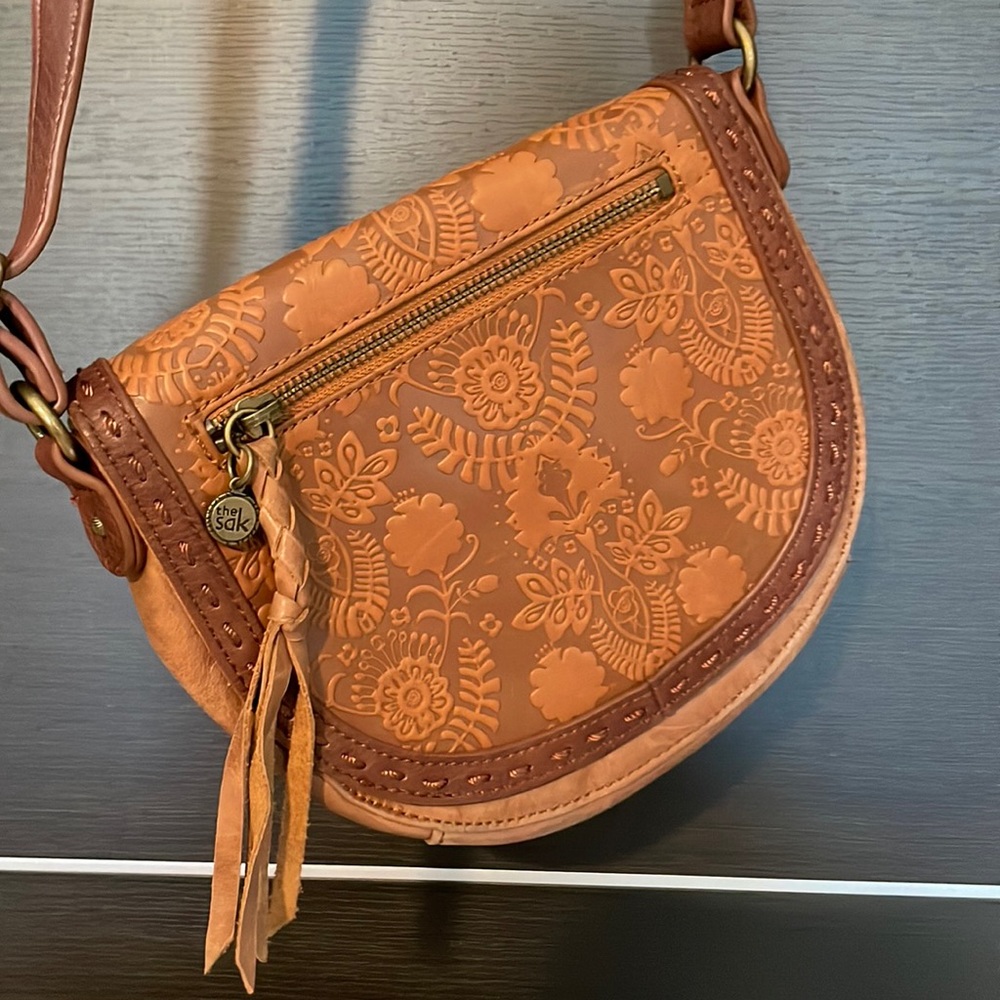 Distressed. Brown leather cross body.